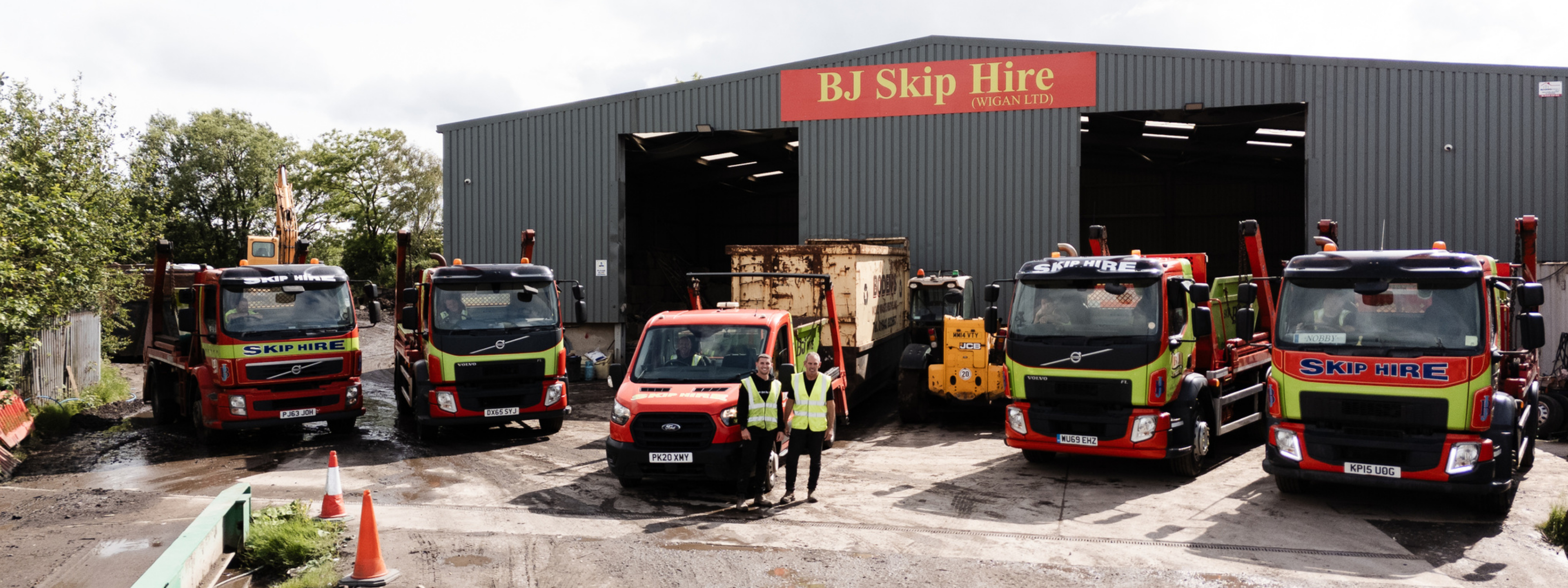 green skips on red truck